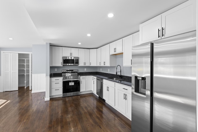 28 Shortwoods Rd, New Fairfield, CT 06812 - kitchen with a sink, white cabinets, appliances with stainless steel finishes, dark wood-style floors, and recessed lighting