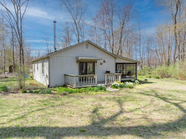 exterior space with a deck and a yard