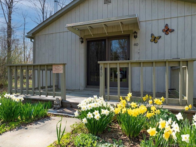 doorway to property with a wooden deck