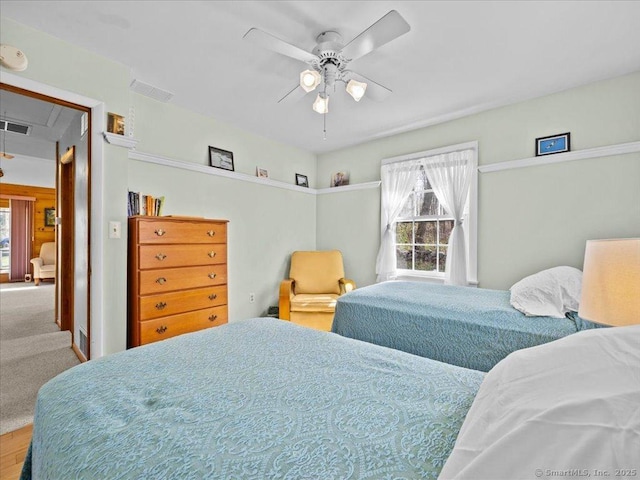 bedroom featuring attic access, multiple windows, and visible vents