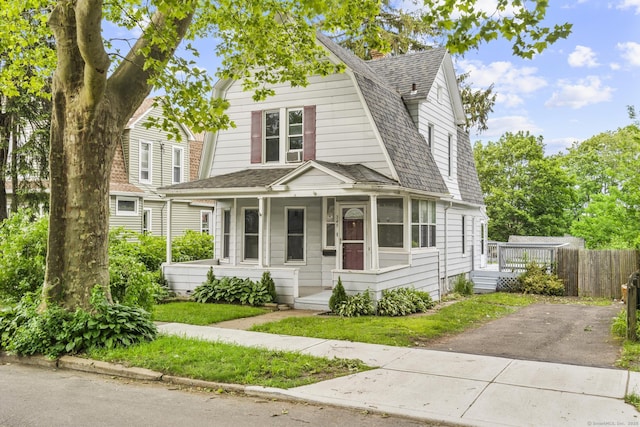 349 Concord St, New Haven, CT 06512 - colonial inspired home featuring a porch, a gambrel roof, roof with shingles, and driveway