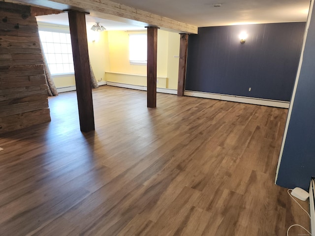 219 Forest St, East Hartford, CT 06118 - basement with a baseboard heating unit, plenty of natural light, and wood finished floors