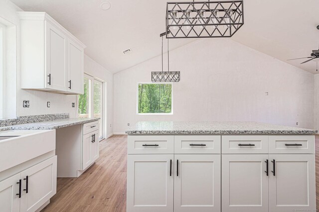 180 Tripp Hollow Rd, Brooklyn, CT 06234 - kitchen featuring light wood-style flooring, white cabinetry, lofted ceiling, ceiling fan, and light stone counters