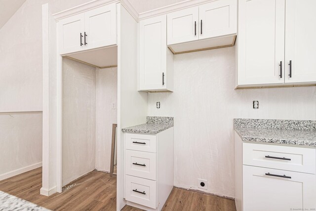 180 Tripp Hollow Rd, Brooklyn, CT 06234 - kitchen featuring light wood-style flooring, light stone counters, and white cabinets