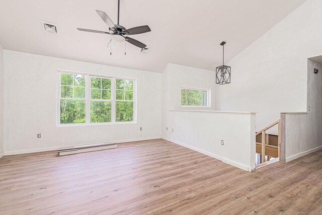 180 Tripp Hollow Rd, Brooklyn, CT 06234 - spare room with a baseboard radiator, plenty of natural light, wood finished floors, baseboards, and high vaulted ceiling
