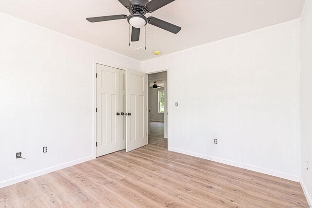 180 Tripp Hollow Rd, Brooklyn, CT 06234 - unfurnished bedroom featuring light wood-style floors, baseboards, a closet, and ceiling fan