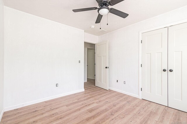 180 Tripp Hollow Rd, Brooklyn, CT 06234 - unfurnished bedroom featuring light wood-style flooring, baseboards, a closet, and a ceiling fan