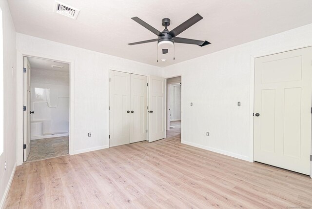 180 Tripp Hollow Rd, Brooklyn, CT 06234 - unfurnished bedroom with light wood-style flooring, baseboards, ensuite bath, and a ceiling fan