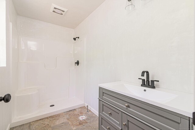 180 Tripp Hollow Rd, Brooklyn, CT 06234 - bathroom featuring vanity, a shower, and baseboards
