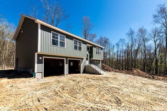 180 Tripp Hollow Rd, Brooklyn, CT 06234 - view of front of house featuring stairs and board and batten siding