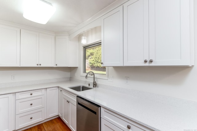 kitchen featuring a sink, white cabinetry, dishwasher, and light countertops