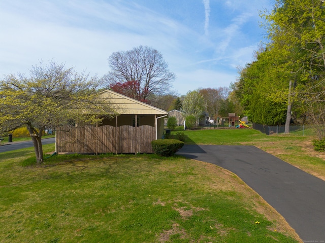 view of community featuring a lawn and a playground