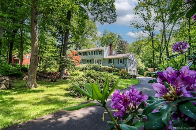 12 Winding Brook Ln, Redding, CT 06896 - back of house with a chimney and a lawn