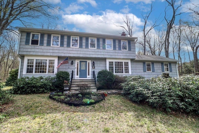 12 Winding Brook Ln, Redding, CT 06896 - colonial home with a chimney and a front yard
