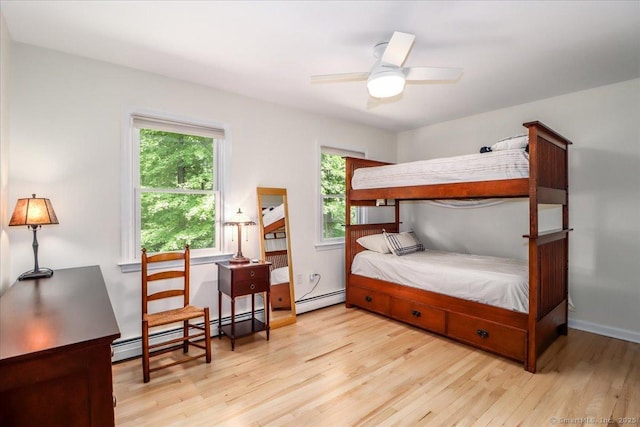 12 Winding Brook Ln, Redding, CT 06896 - bedroom with wood finished floors, baseboard heating, and a ceiling fan