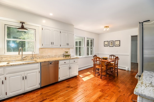 12 Winding Brook Ln, Redding, CT 06896 - kitchen with stainless steel appliances, white cabinetry, light stone countertops, light wood finished floors, and recessed lighting