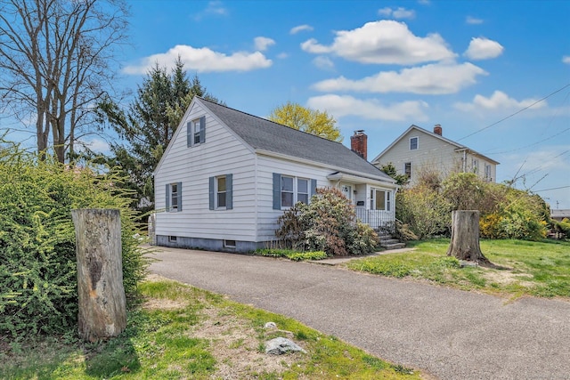 view of front of property featuring roof with shingles