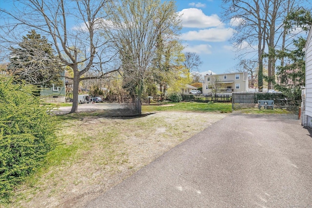 view of street featuring aphalt driveway