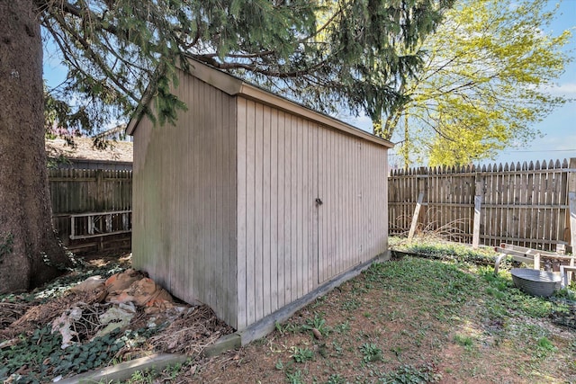 view of shed featuring a fenced backyard