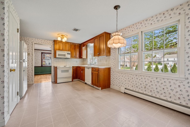 kitchen featuring wallpapered walls and white appliances