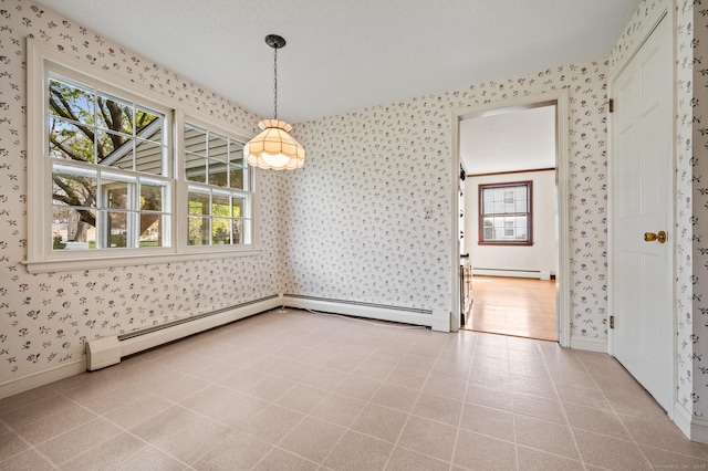 unfurnished dining area featuring a healthy amount of sunlight and wallpapered walls