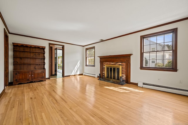unfurnished living room with light wood-style floors, a baseboard radiator, and crown molding
