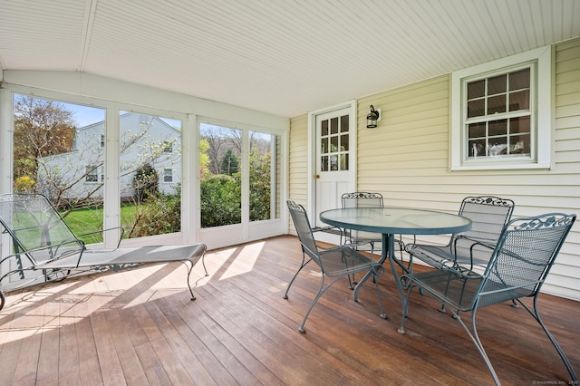 sunroom / solarium with outdoor dining area
