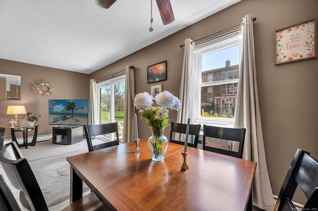dining space with a ceiling fan, carpet flooring, baseboard heating, and baseboards