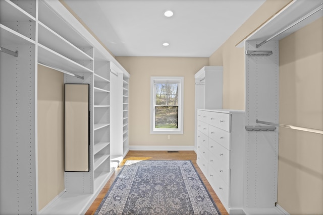 walk in closet featuring light wood-style floors