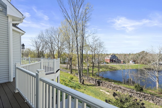 wooden terrace with a water view