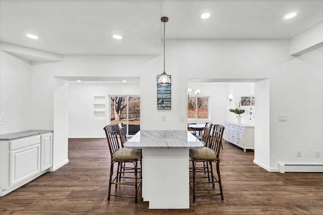 dining space with recessed lighting, dark wood-type flooring, and baseboard heating