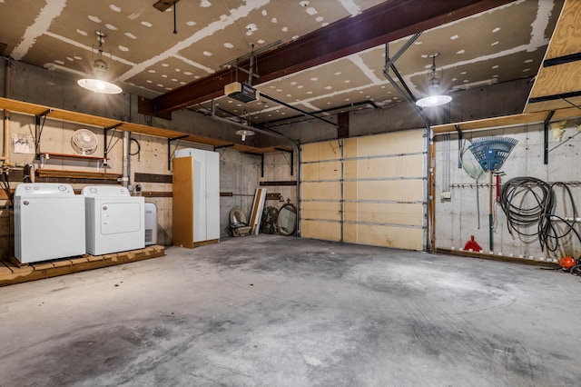 garage featuring separate washer and dryer and a garage door opener