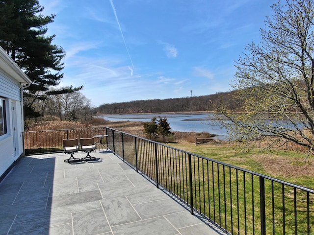 view of patio / terrace featuring a water view