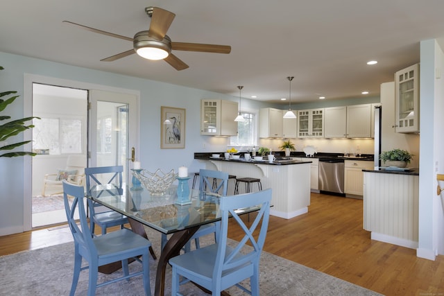 dining area featuring light wood-type flooring, ceiling fan, and recessed lighting
