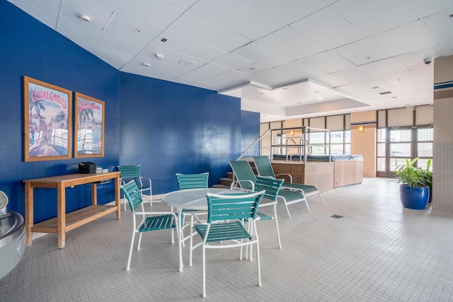 dining room with a drop ceiling