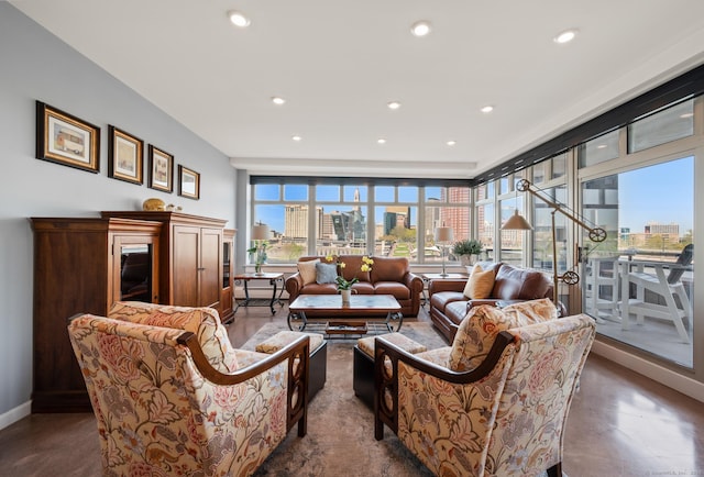 living room with a view of city, baseboards, and recessed lighting