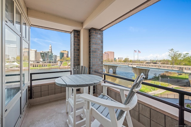balcony featuring a water view