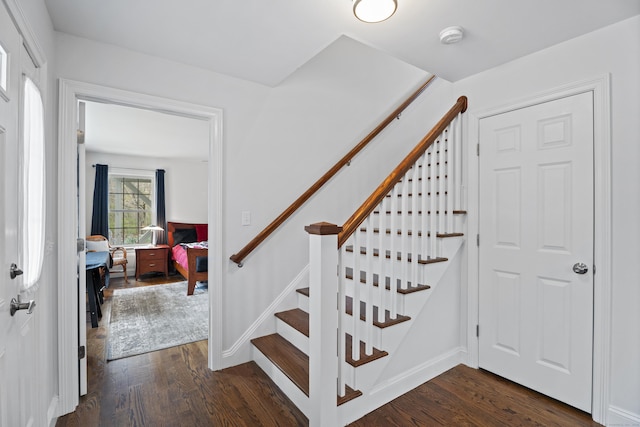 stairs with wood finished floors