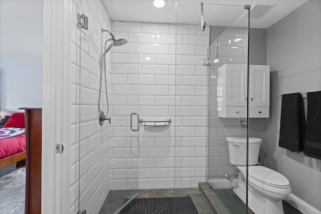 full bath with toilet and a stall shower