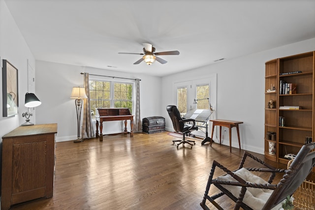 home office with a ceiling fan, dark wood finished floors, and baseboards