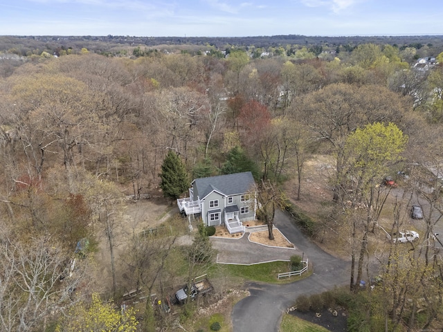 aerial overview of property's location featuring a heavily wooded area