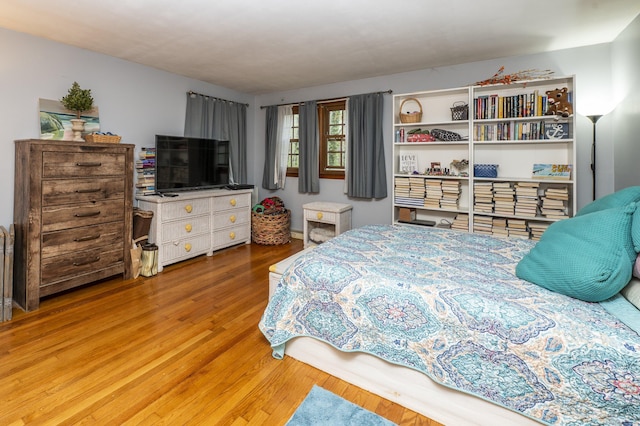 bedroom with wood finished floors