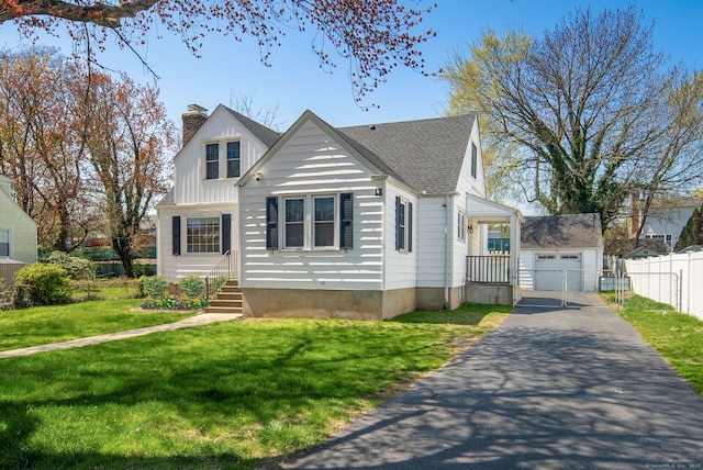 43 Bibbins Ave, Fairfield, CT 06825 - bungalow-style house featuring fence, a front lawn, aphalt driveway, a detached garage, and a chimney