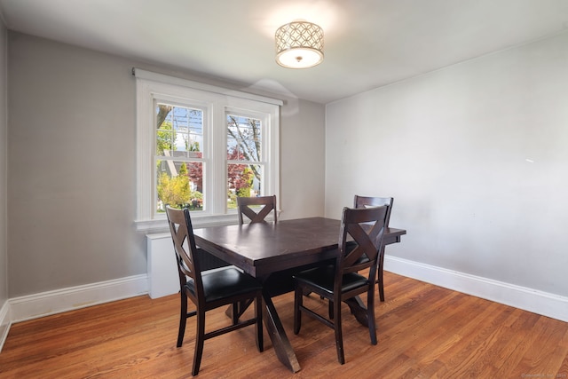 43 Bibbins Ave, Fairfield, CT 06825 - dining space with baseboards and light wood-style flooring