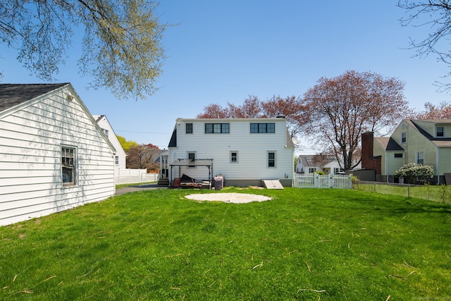 43 Bibbins Ave, Fairfield, CT 06825 - rear view of property featuring fence and a yard