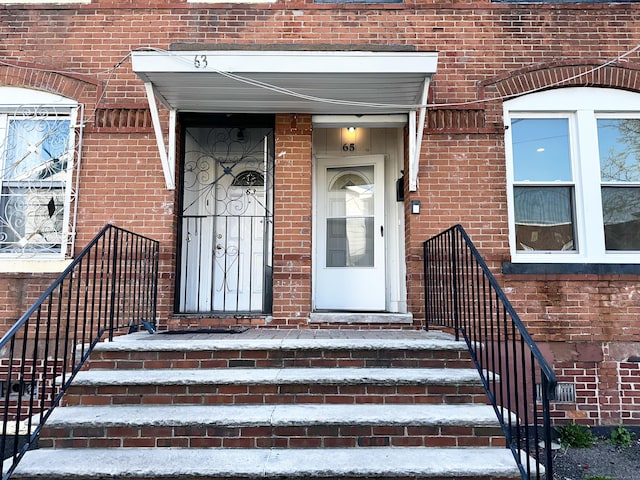 65 Beach St, Bridgeport, CT 06608 - property entrance featuring brick siding