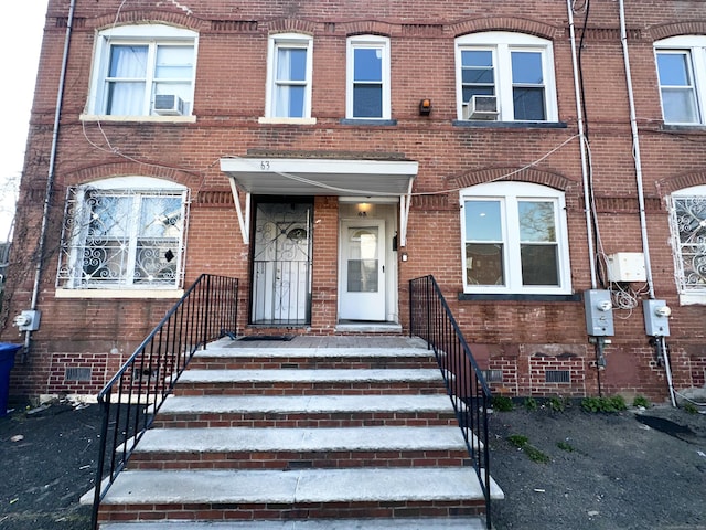 65 Beach St, Bridgeport, CT 06608 - view of front of house featuring brick siding
