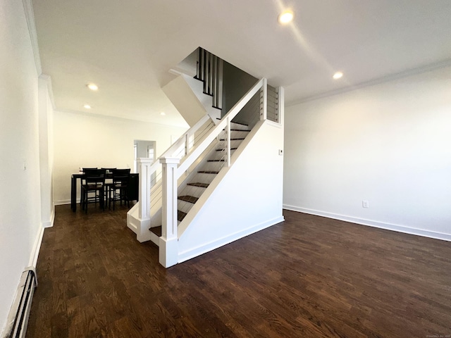 65 Beach St, Bridgeport, CT 06608 - stairs with baseboard heating, baseboards, wood finished floors, and recessed lighting