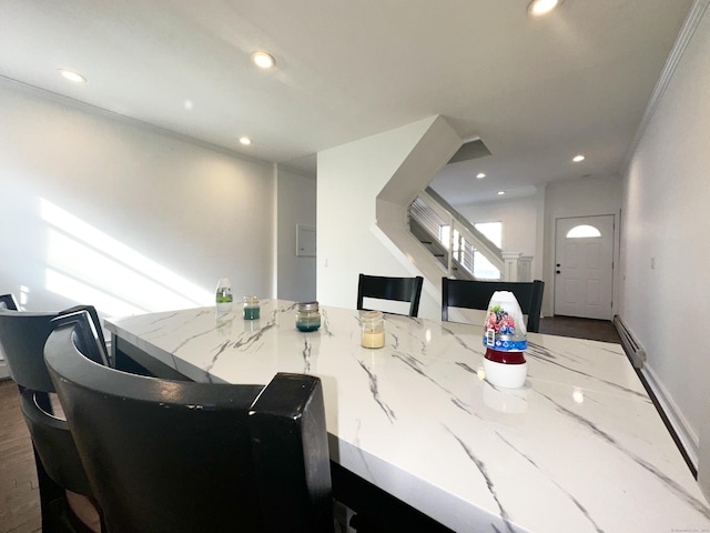 65 Beach St, Bridgeport, CT 06608 - dining space featuring a baseboard radiator, stairs, and recessed lighting