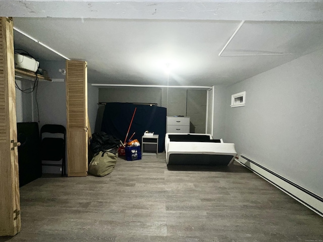 65 Beach St, Bridgeport, CT 06608 - bedroom with a baseboard heating unit and wood finished floors
